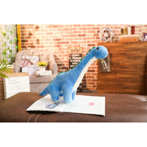 Blue Dinosaur Plüschtier in einem Wohnzimmer auf einem Tisch
