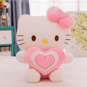 Hello Kitty Plüschtier mit einem Herz, das auf einem Tisch sitzt
